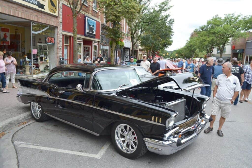 Lots of people looking at classic cars in Downtown Orillia.