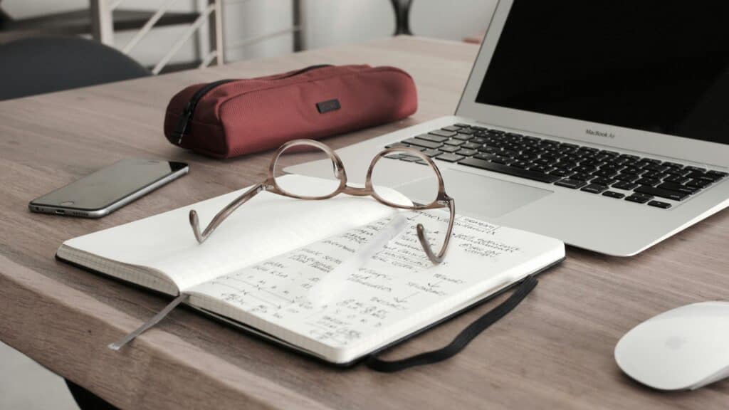 book and glasses on desk