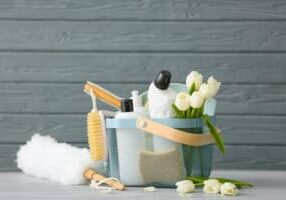 Set,Of,Cleaning,Supplies,And,Spring,Flowers,On,Grey,Wooden